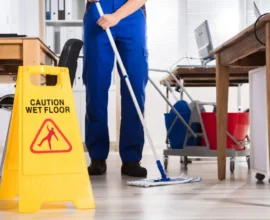 Cleaner cleaning the floor in a Nairobi office, S & M Cleaners office cleaning company
